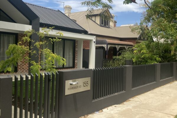Residential boundary fence with a custom access gate